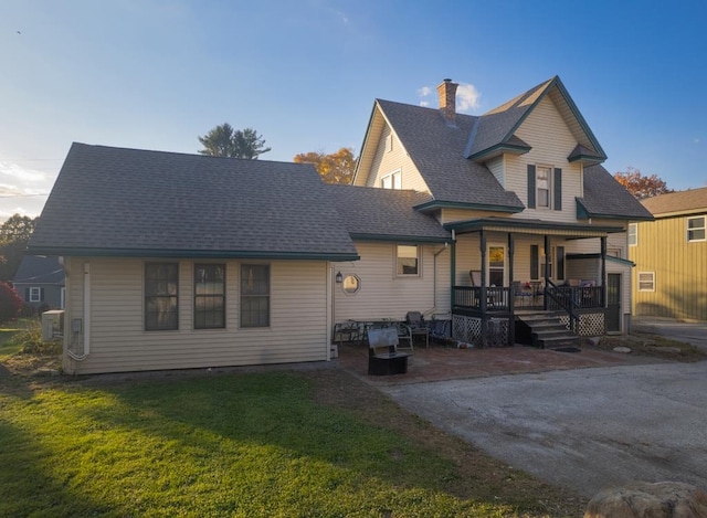 view of front of home with a front lawn and a porch