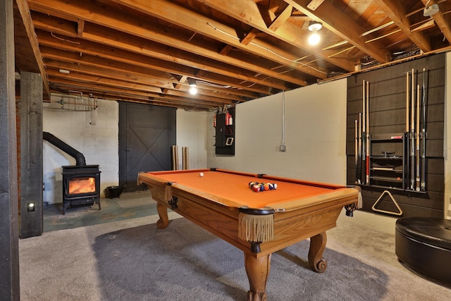 rec room featuring electric panel, a wood stove, and billiards