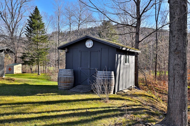 view of outbuilding with a lawn