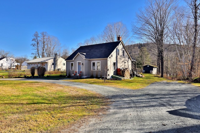 view of side of home featuring a yard