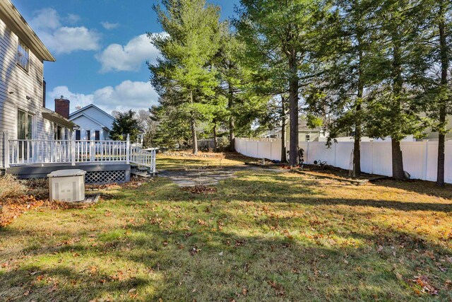 view of yard with a wooden deck