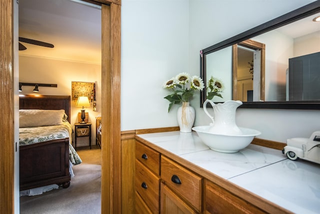 bathroom featuring vanity and ceiling fan