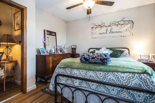 bedroom with hardwood / wood-style flooring and ceiling fan