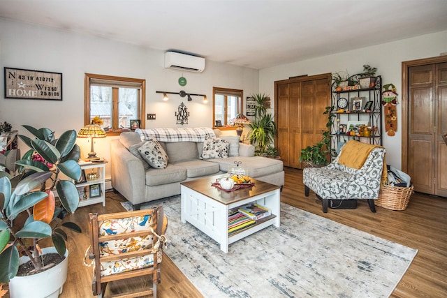 living room with hardwood / wood-style flooring and a wall mounted AC