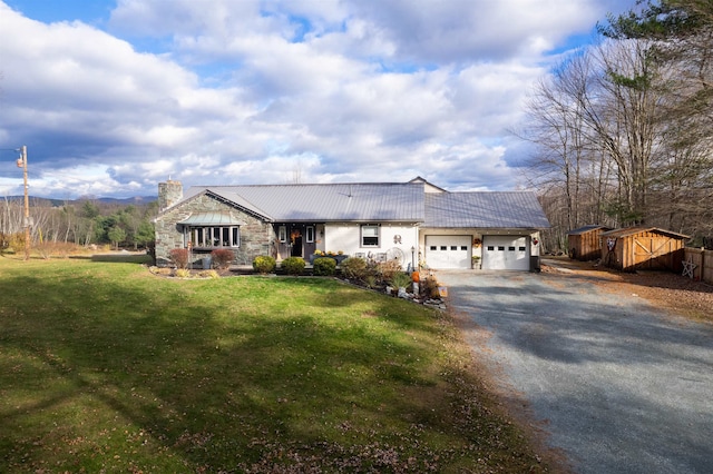 ranch-style home featuring a garage and a front lawn