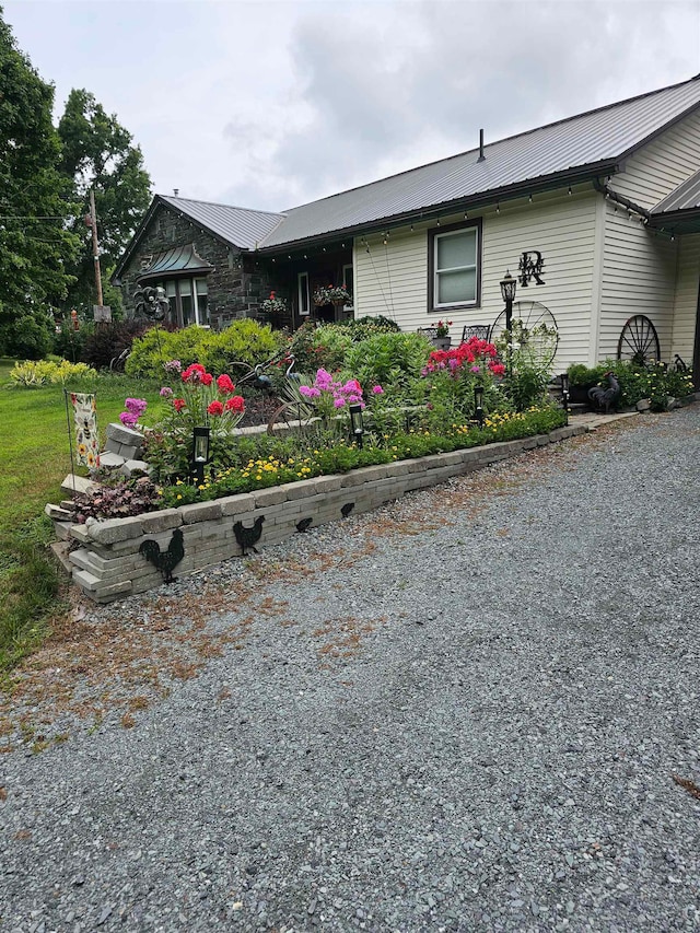 view of side of home with a lawn