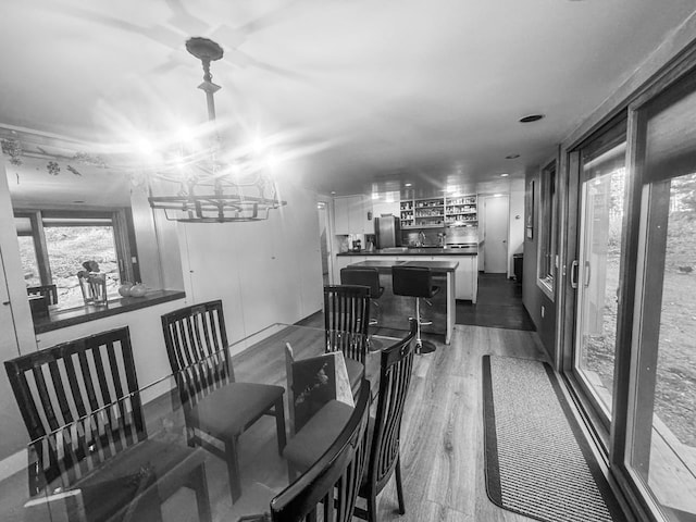 dining space with dark hardwood / wood-style floors