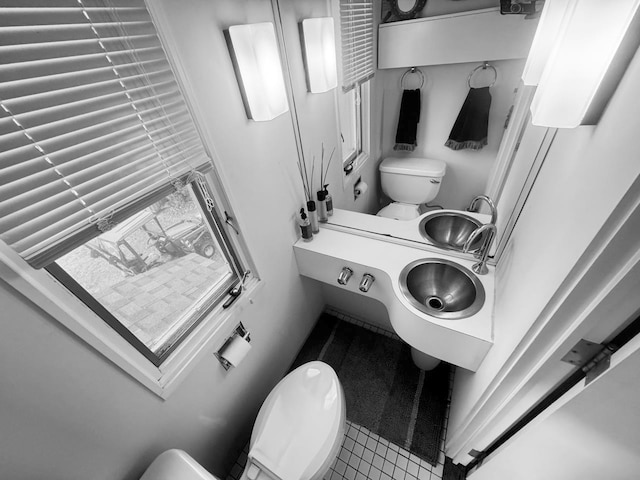 bathroom featuring tile patterned floors and toilet