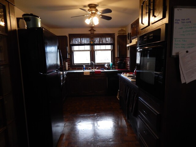 kitchen featuring ceiling fan, sink, and black appliances