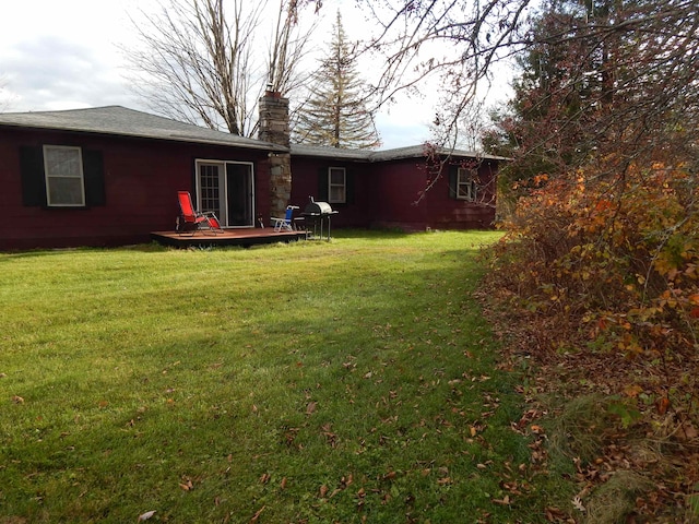 back of property with a yard