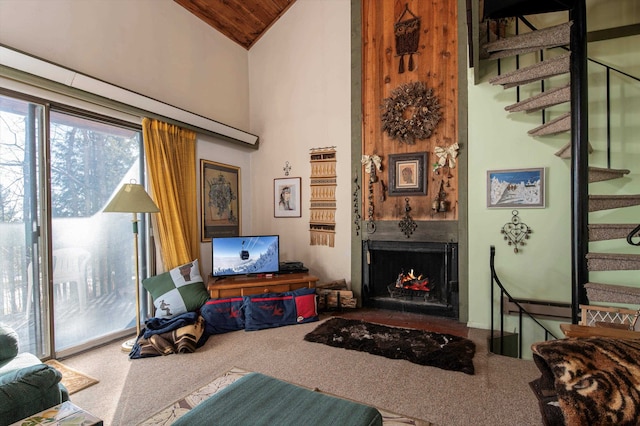 carpeted living room featuring vaulted ceiling and wood ceiling