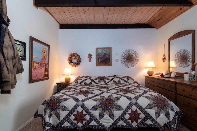 carpeted bedroom featuring beam ceiling and wooden ceiling