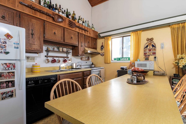 kitchen featuring kitchen peninsula, white appliances, and sink