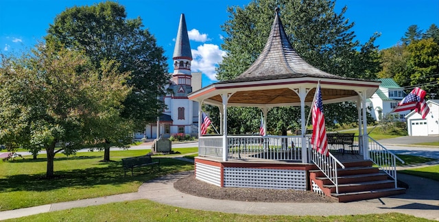 surrounding community with a gazebo and a yard