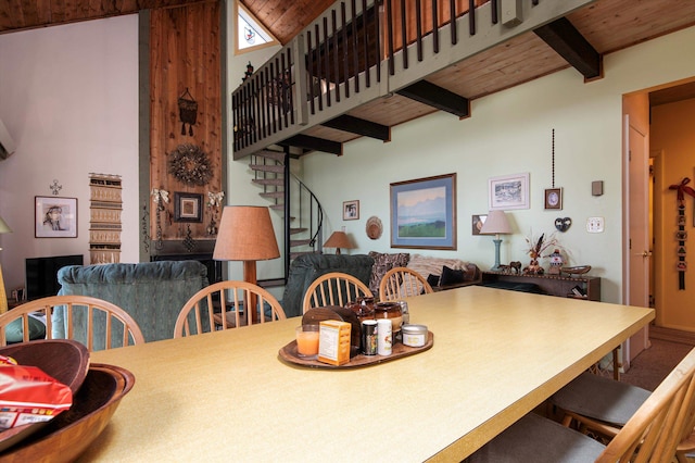 dining space with lofted ceiling with beams and wooden ceiling