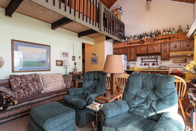 living room with beam ceiling, high vaulted ceiling, wooden ceiling, and sink