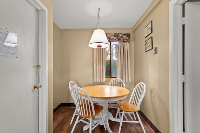 dining room featuring dark hardwood / wood-style flooring