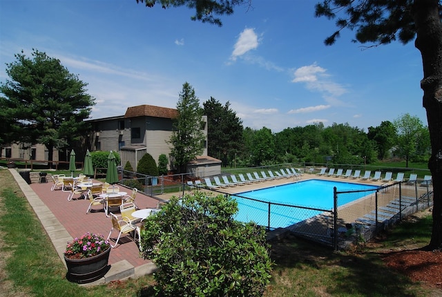 view of swimming pool featuring a patio area