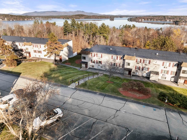 birds eye view of property featuring a water and mountain view