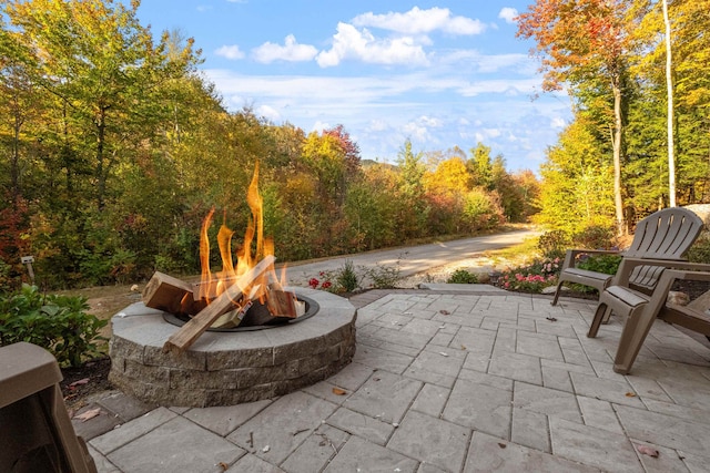 4 Hay Hill Rd, Lincoln, NH 03251 - view of patio with a fire pit and a wooded view