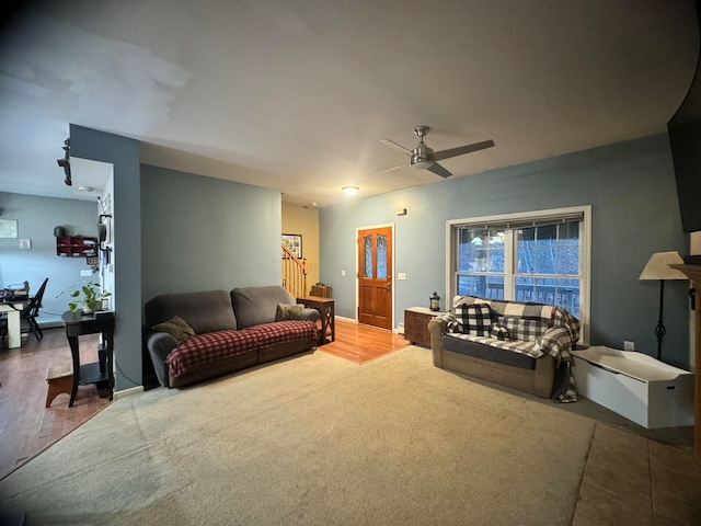 living room with hardwood / wood-style floors and ceiling fan