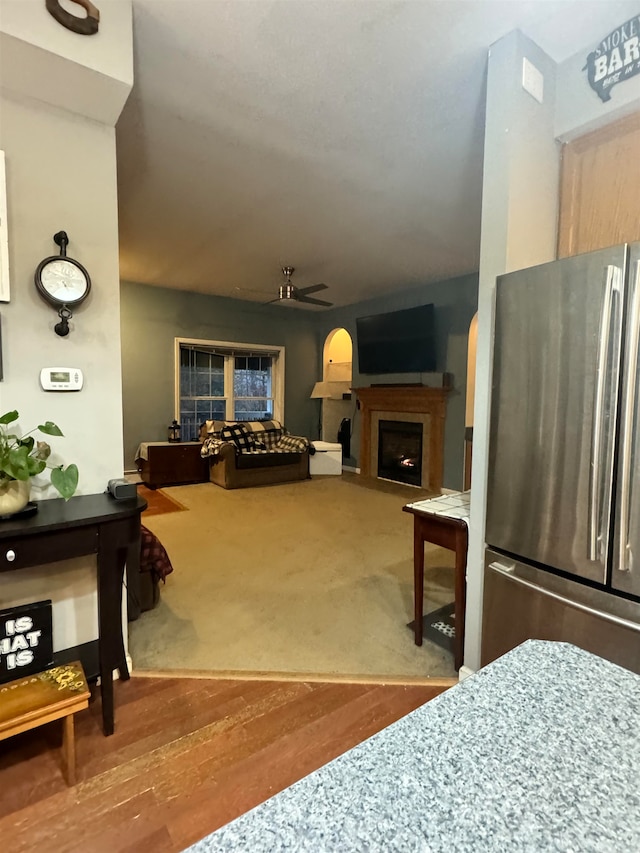 interior space with hardwood / wood-style floors and ceiling fan