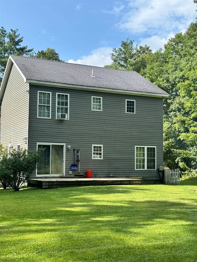 back of property featuring a yard