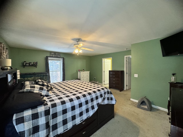 bedroom with light carpet and ceiling fan