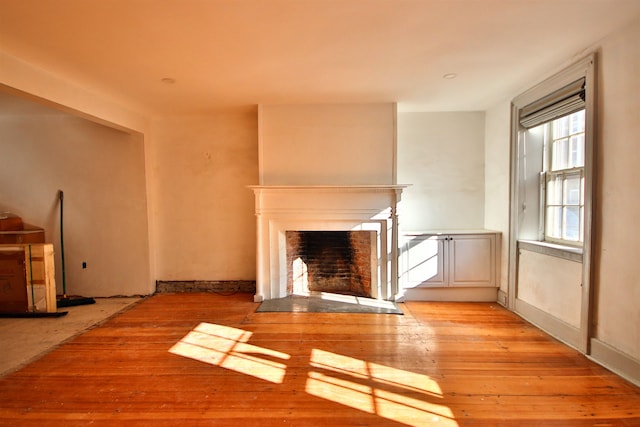 unfurnished living room featuring light wood-type flooring