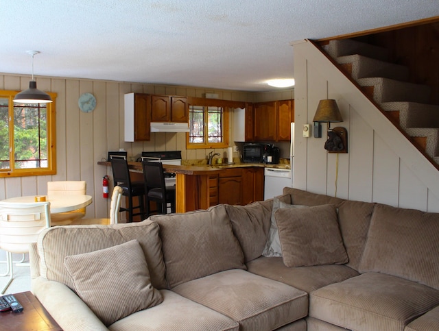 living room with sink and a textured ceiling