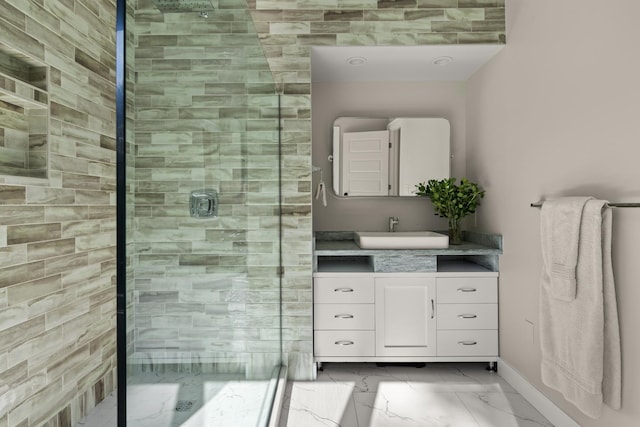 bathroom with vanity and a shower with shower door