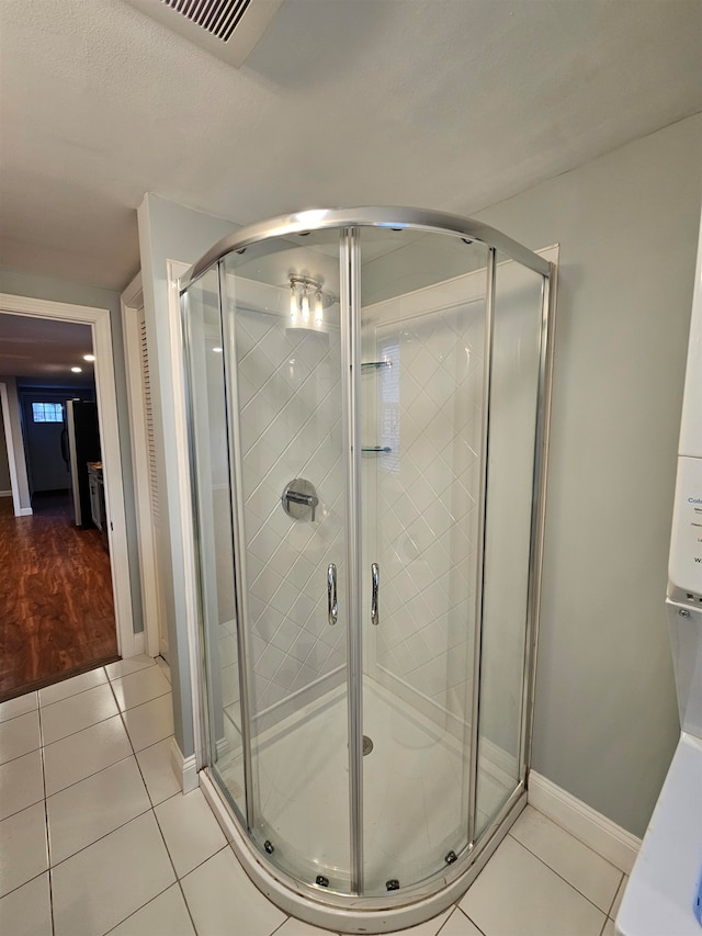 bathroom featuring tile patterned flooring and walk in shower