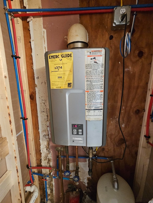 utility room featuring water heater