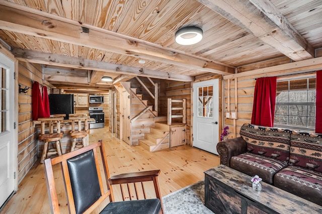 living room with beamed ceiling, wooden walls, hardwood / wood-style flooring, and wooden ceiling