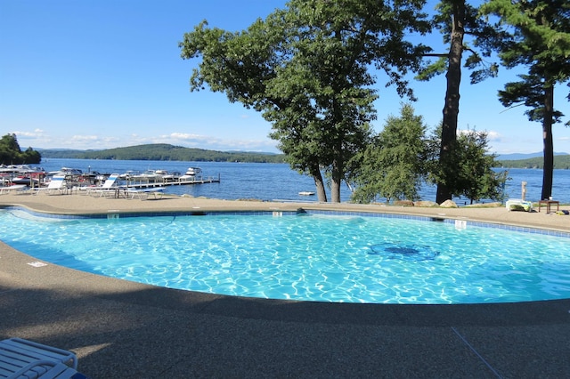 view of pool featuring a water and mountain view