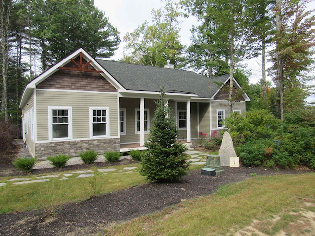 craftsman-style home with a front yard