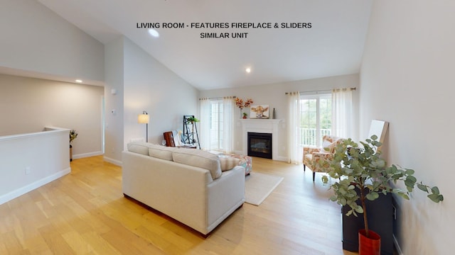 living room featuring light hardwood / wood-style flooring and high vaulted ceiling