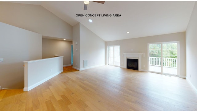 unfurnished living room featuring light wood-type flooring, ceiling fan, and vaulted ceiling