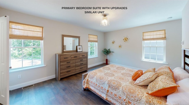 bedroom with dark hardwood / wood-style floors