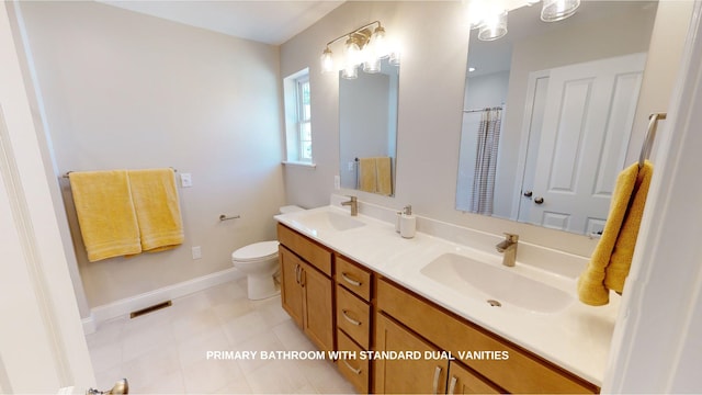 bathroom featuring toilet and vanity