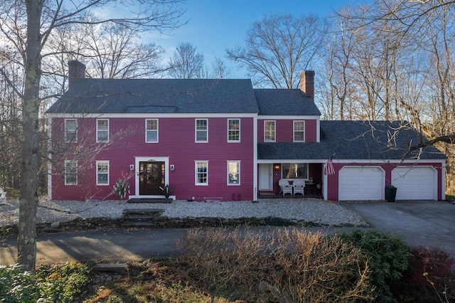 colonial-style house featuring a garage