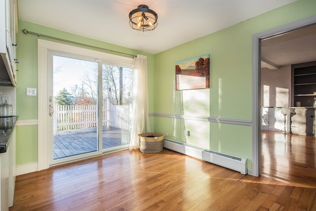 interior space featuring hardwood / wood-style flooring and a baseboard radiator