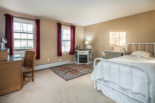 bedroom with carpet and a baseboard radiator