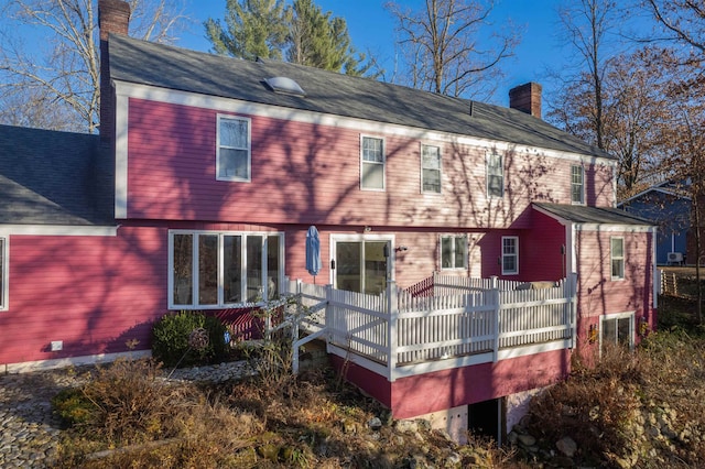 back of property featuring a wooden deck