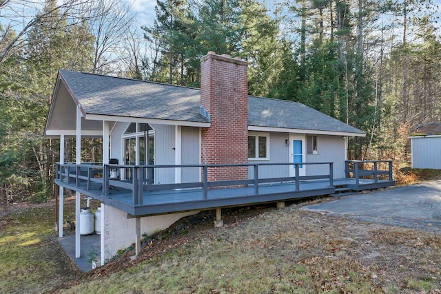 69 Grandview Dr, Woodstock, NH 03293 - back of property with a deck