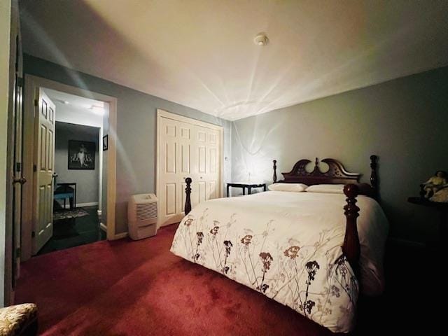 bedroom with carpet and a closet