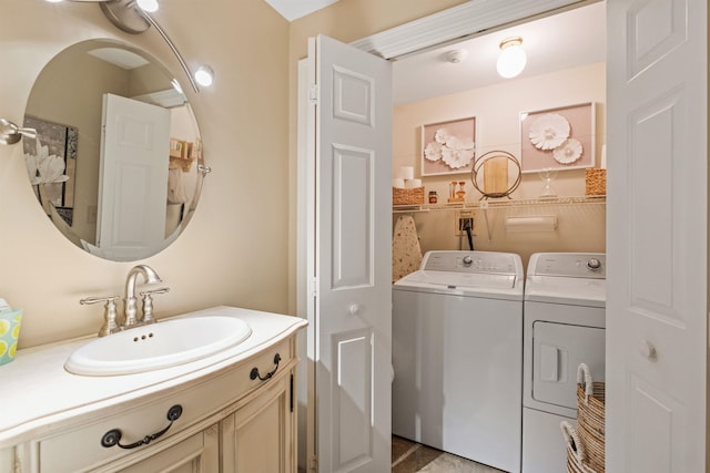 bathroom with independent washer and dryer and vanity