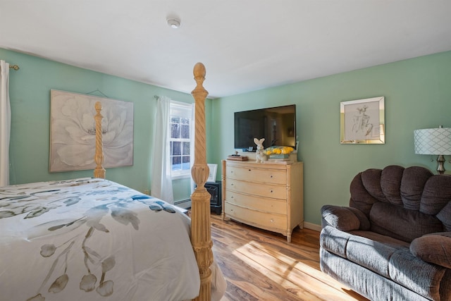 bedroom with light hardwood / wood-style floors