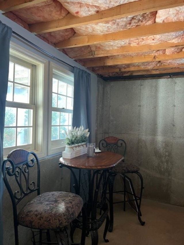 dining room featuring concrete flooring