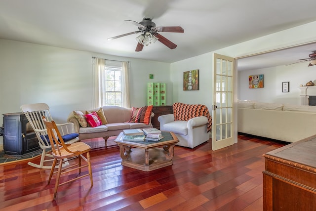 living room featuring ceiling fan, dark hardwood / wood-style flooring, and french doors